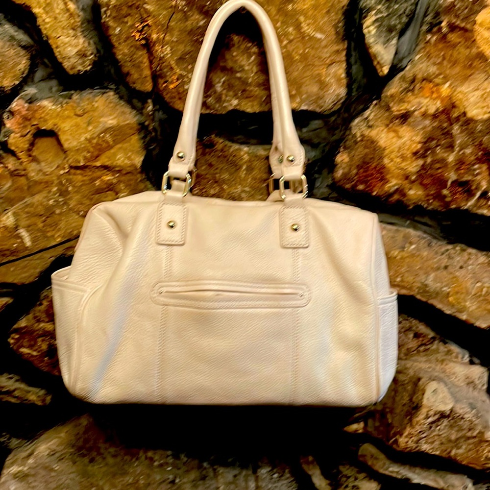 Awsome beige Calvin Klein all leather, double handles bag. Pockets on both sides